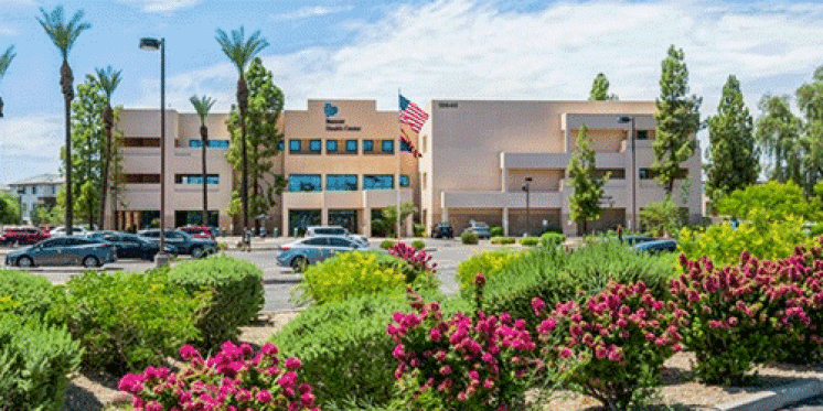 Medical office building with a plants in front